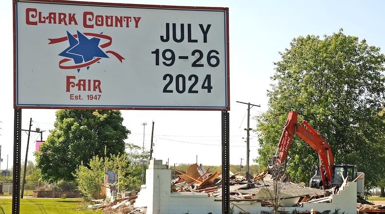 A crew from Tony Smith Wrecking made short work of the old Clark County Fairground offices Thursday, May 2, 2024. The old building, located along South Charleston Pike, was replaced last year with a new $1 million office building nearby. The county has plans to develop the fairgrounds land along the roadway. BILL LACKEY/STAFF