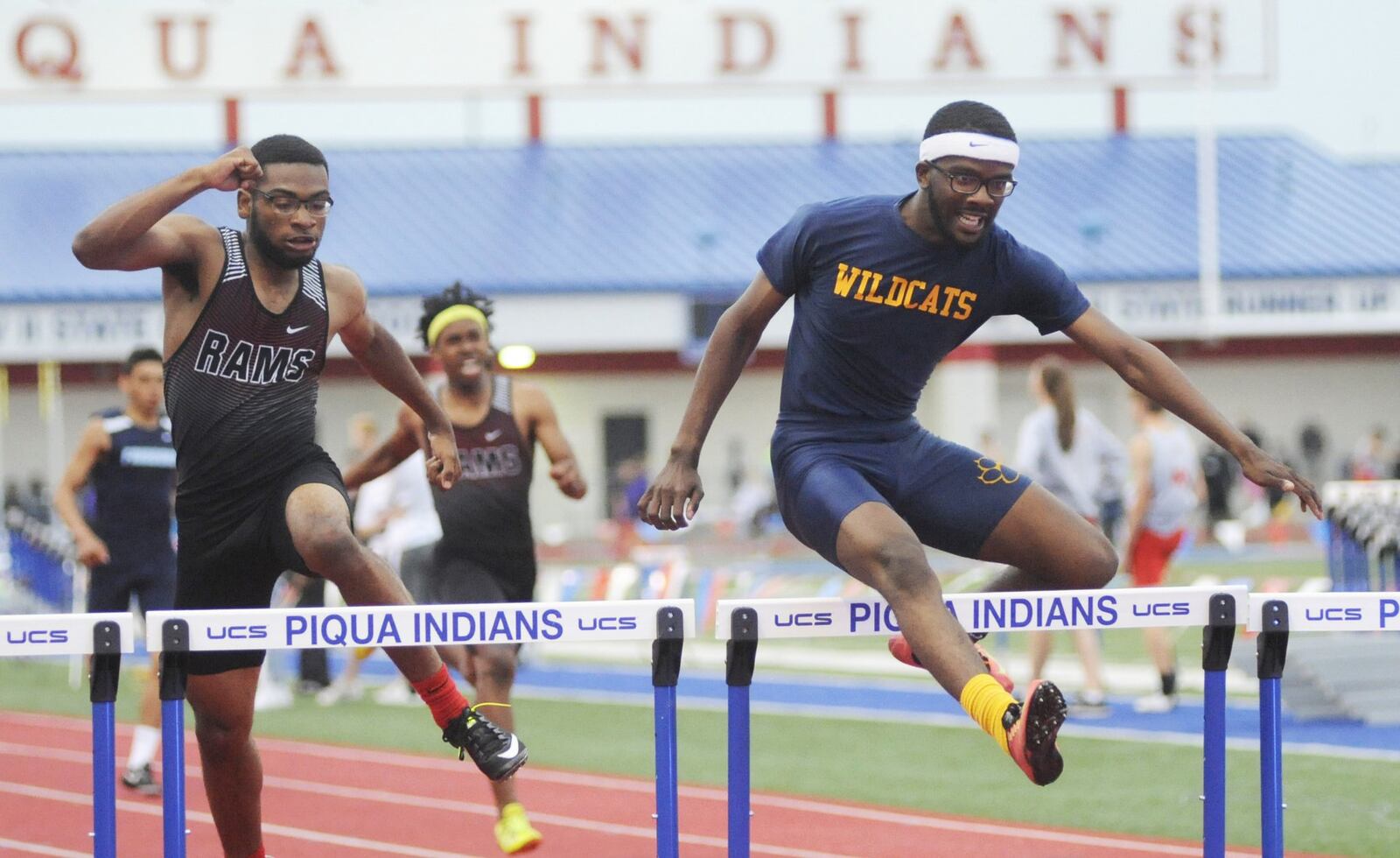 Springfield’s Austin Tyree (right) beats Joshua Byars-Mason of Trotwood-Madison to win the 300 hurdles. One of two D-I track and field meets was at Piqua on Friday, May 18, 2018. MARC PENDLETON / STAFF