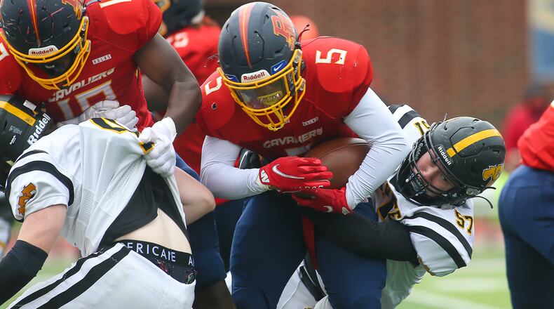 Shawnee High School junior Braden Greene tackle's Purcell Marian's Jesse Jenkins during their game on Saturday, Oct. 30 at Walnut Hills High School in Cincinnati. CONTRIBUTED PHOTO BY MICHAEL COOPER