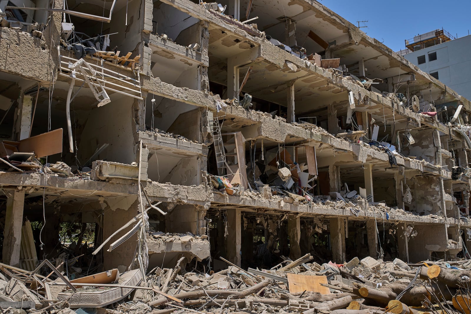 A damaged building after a missile strike launched from Iran in Tel Aviv, Israel, on Sunday, June 22, 2025. (AP Photo/Bernat Armangue)