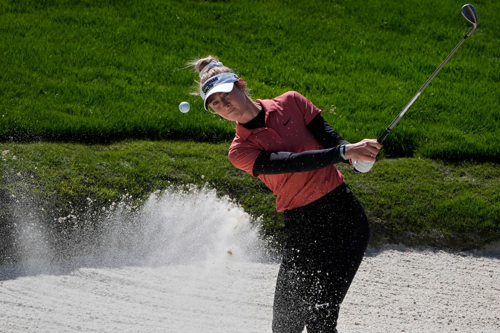 FILE - Nelly Korda hits out of a bunker at the fourth green during the final round of the LPGA T-Mobile Match Play golf tournament Sunday, April 7, 2024, in North Las Vegas, Nev. (AP Photo/John Locher, File)