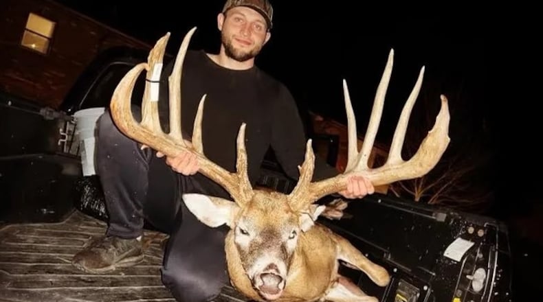 Hunter Christopher "CJ" Alexander poses with the deer he took in Clinton County. The deer's rack was green-scored at a typical 206 7/8 inches, which would push it 5 inches past the Ohio record. Photo provided by Sierra Smith.