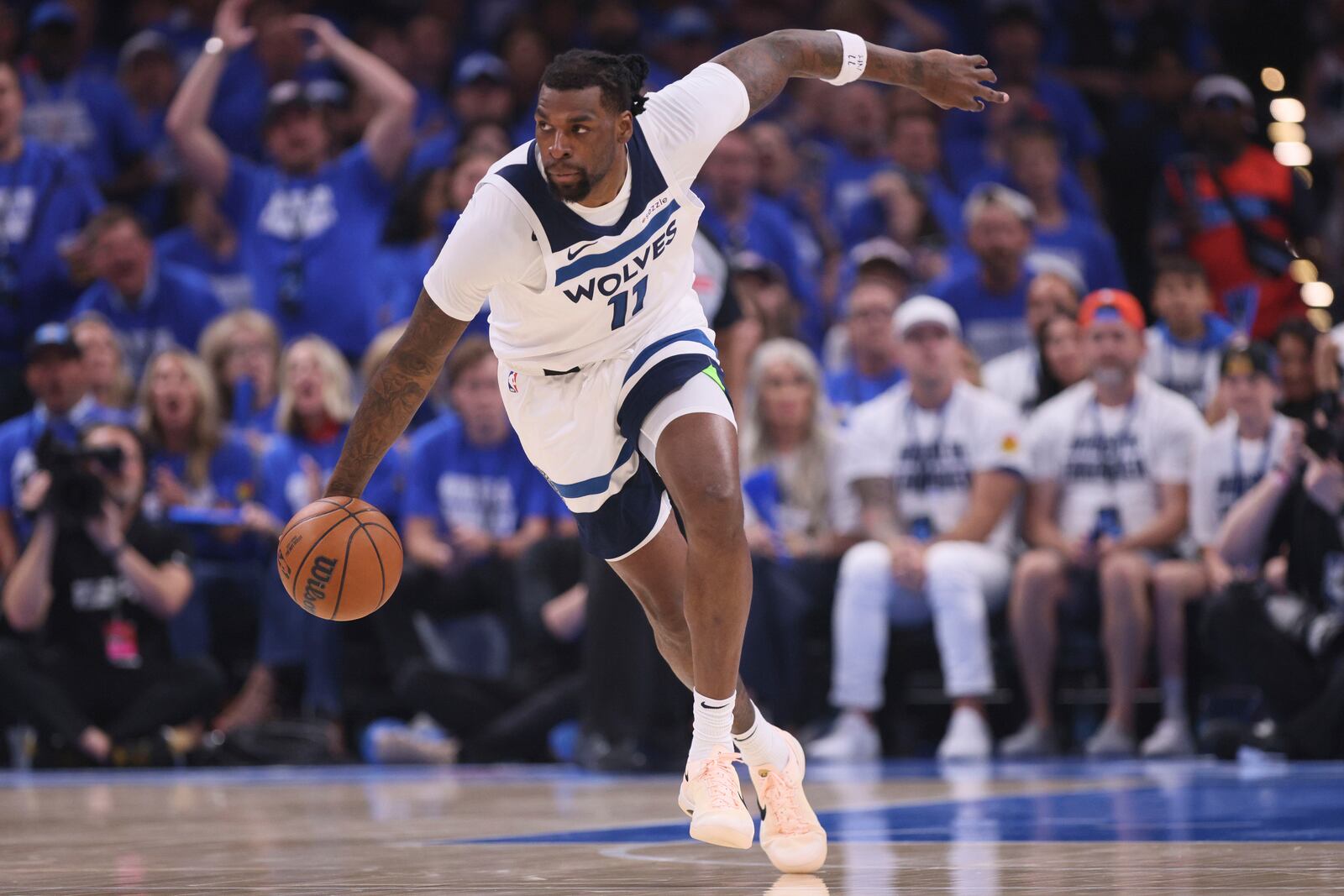 Minnesota Timberwolves center Naz Reid (11) works toward the basket during the first half of Game 5 of the Western Conference finals of the NBA basketball playoffs against the Oklahoma City Thunder, Wednesday, May 28, 2025, in Oklahoma City. (AP Photo/Nate Billings)