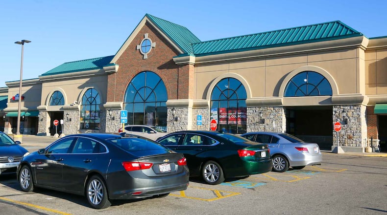 Kroger has asked customers to stop open carrying firearms in its family of stores. GREG LYNCH/STAFF