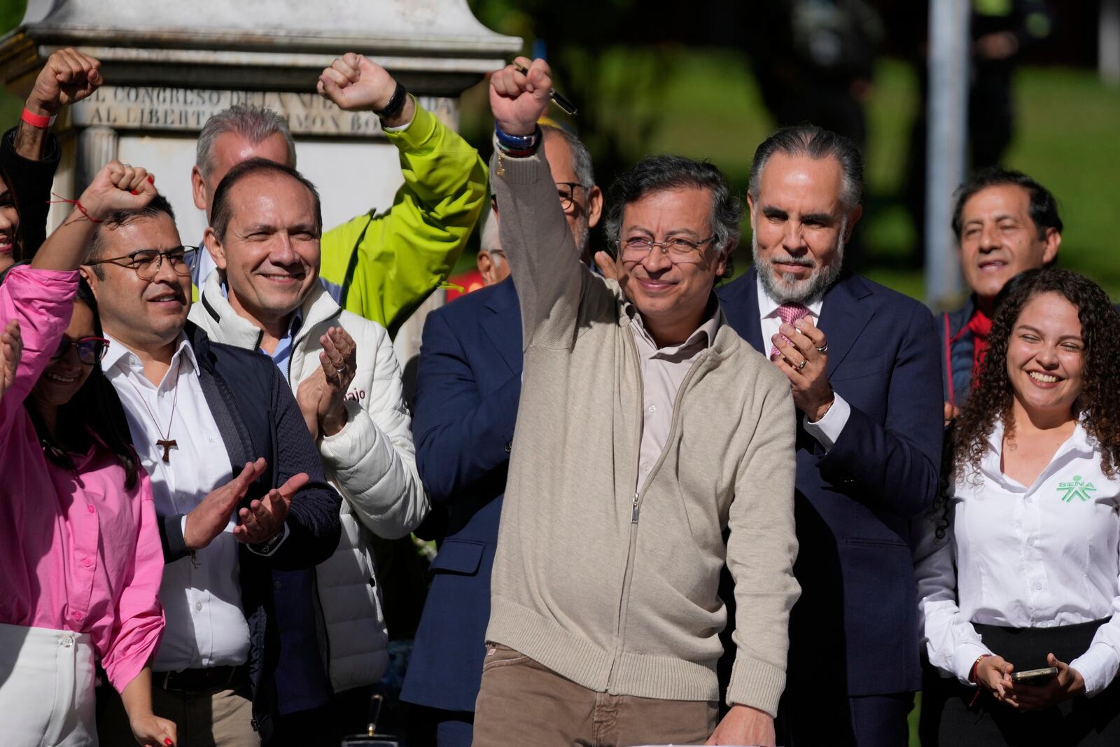 Colombia's President Gustavo Petro raises a fist before signing a labor reform bill into law in Bogota, Colombia, Wednesday, June 25, 2025. (AP Photo/Fernando Vergara)