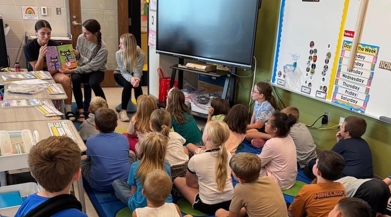 The Shawnee High School Volleyball Team recently visited Shawnee Elementary, where the Braves paired up with younger students to read books together, sharing their love of stories to inspire a passion for learning. CLARK-SHAWNEE LOCAL SCHOOLS / CONTRIBUTED