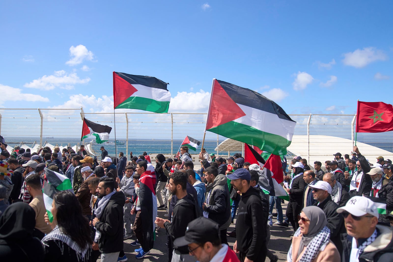 Moroccans protest the docking of a Maersk cargo ship carrying airplane parts they suspect are headed to Israel, outside Tangier Med Port, Sunday, April 20, 2025. (AP Photo/Mosa'ab Elshamy)