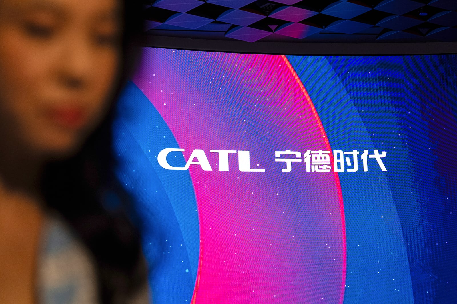 Signage of Contemporary Amperex Technology Co. (CATL) is displayed on the digital screen at the listing ceremony in Hong Kong, Tuesday, May. 20, 2025. (AP Photo/Chan Long Hei)