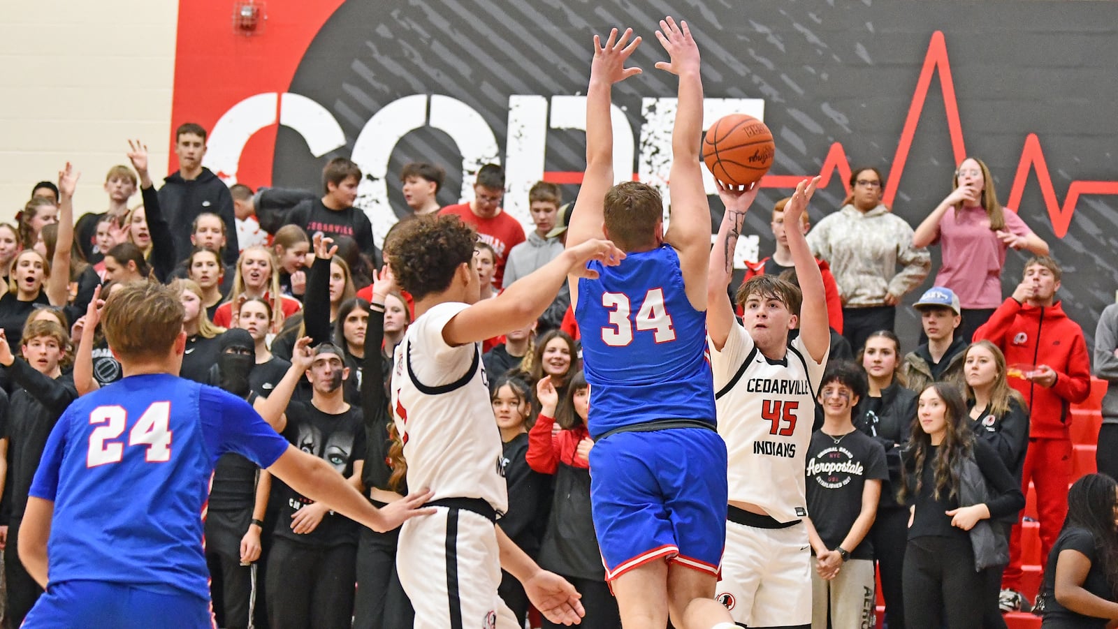 Cedarville's Brayden Trimbach shoots from 3-point ranger over Greeneview's Trent Webb during Friday night's Ohio Heritage Conference game at Cedarville. Jeff Gilbert/CONTRIBUTED