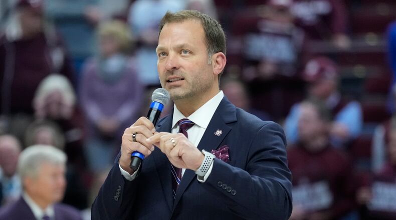 FILE -Texas A&M athletic director Ross Bjork speaks to the crowd at Reed Arena during a ceremony for Texas A&M head coach Gary Blair after an NCAA college basketball game Thursday, Feb. 24, 2022, in College Station, Texas. Texas A&M athletic director Ross Bjork has been hired at Ohio State to replace longtime athletic director Gene Smith, who will retire July 1. Ohio State leaders announced Bjork's hiring on Tuesday, Jan. 16, 2024. (AP Photo/Sam Craft, File)