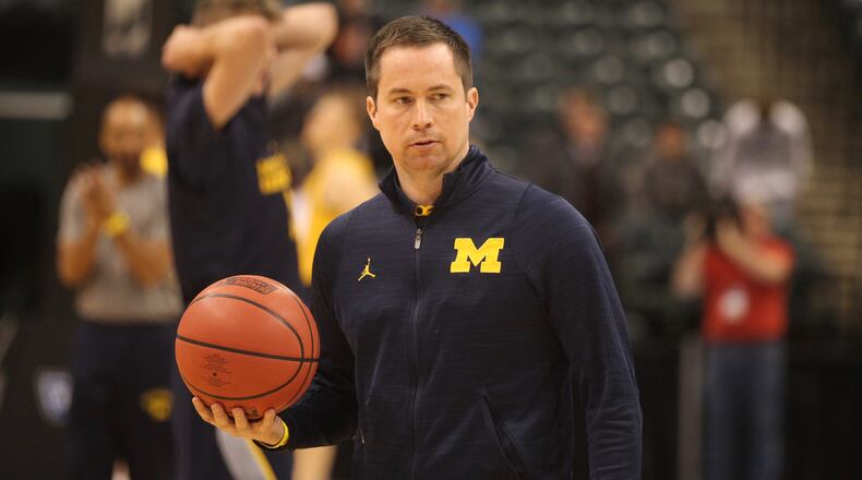 Michigan assistant coach Billy Donlon watches the team practice on Thursday, March 16, 2017, at Bankers Life Fieldhouse in Indianapolis. David Jablonski/Staff