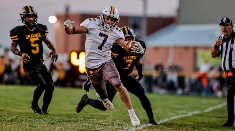 Kenton Ridge High School junior Brody Runkle tip toes the sideline during their game at Shawnee on Friday, Sept. 12 in Springfield. The Cougars won 42-14. MICHAEL COOPER/STAFF PHOTO