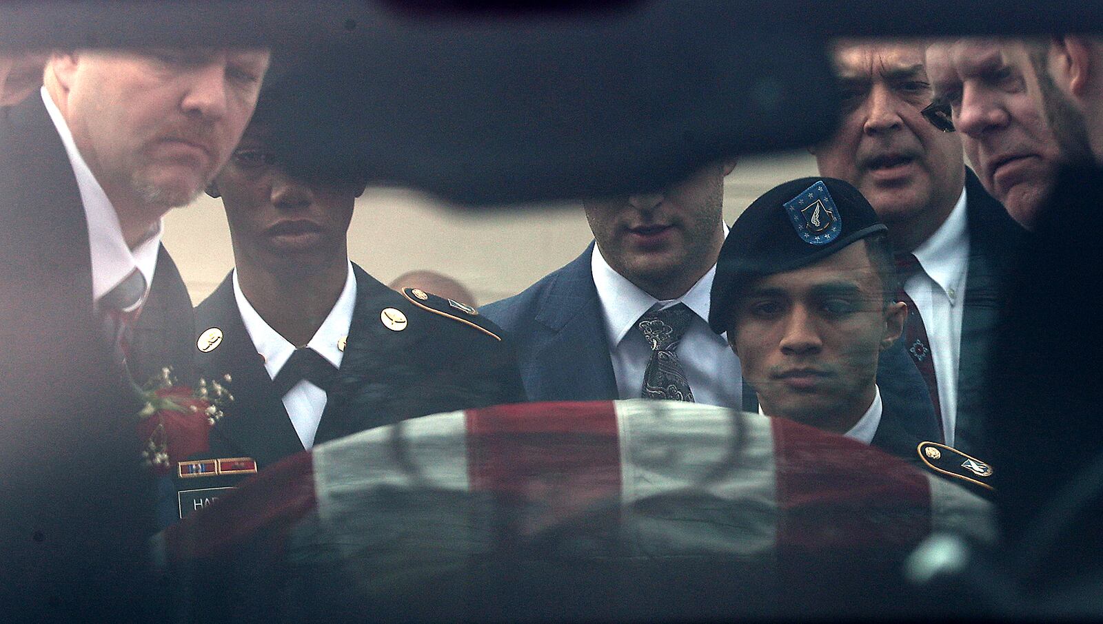 Funeral services were held Monday for Army Spc. Cameron Logwood in the Urbana High School auditorium. The 21-year-old Urbana High School graduate was killed in a traffic crash earlier this month while stationed in Alaska. BILL LACKEY/STAFF