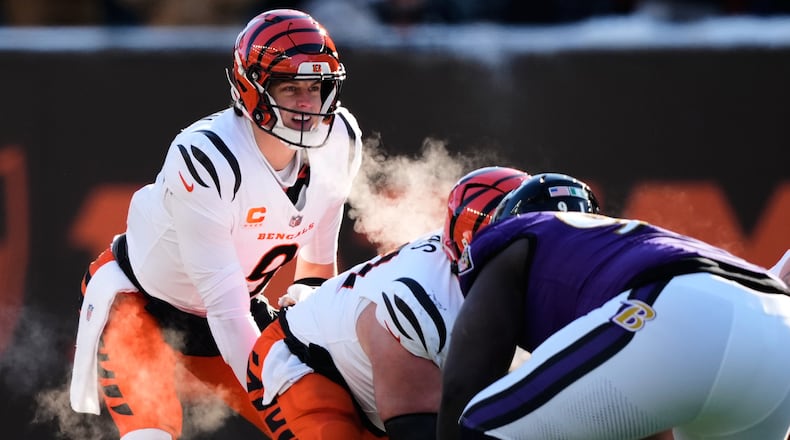 Cincinnati Bengals quarterback Joe Burrow (9) calls the cadence during the first half of an NFL football game against the Baltimore Ravens, Sunday, Dec. 14, 2025, in Cincinnati. (AP Photo/Carolyn Kaster)