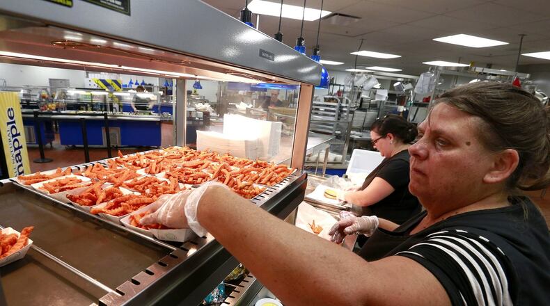 Schools in Clark and Champaign counties work to finalize food service guidelines for the fall. This is Sue Snyder stocking up on food a few years ago at Springfield High School. Bill Lackey/Staff
