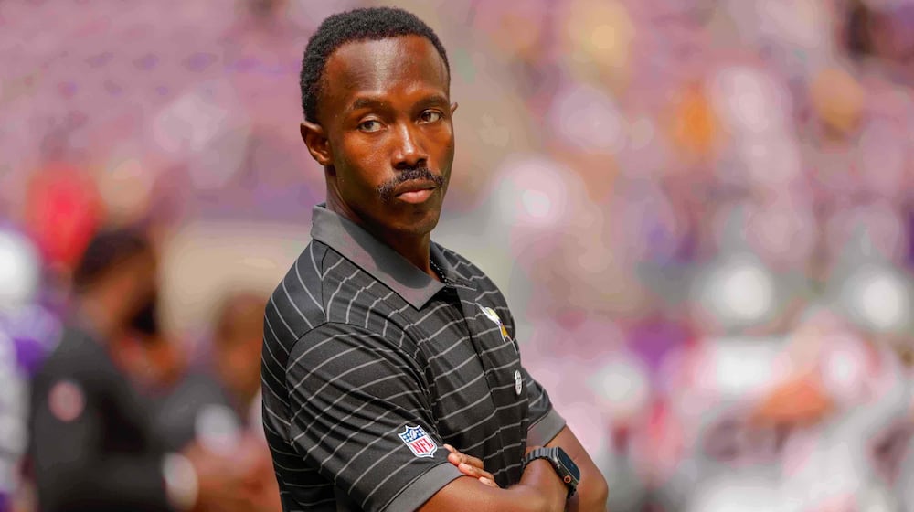 FILE - Minnesota Vikings general manager Kwesi Adofo-Mensah watches his team prepare before the start of a preseason NFL football game against the New England Patriots Saturday, Aug. 16, 2025, in Minneapolis. (AP Photo/Bruce Kluckhohn, File)