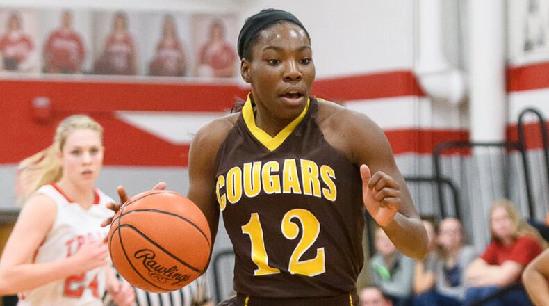 Kenton Ridge senior forward Jamari McDavid dribbles down the court during a nonconference game against Southeastern on Nov. 25. McDavid averages 26 points and nine rebounds per game for the Cougars, who open tournament play on Monday. BRYANT BILLING / CONTRIBUTED