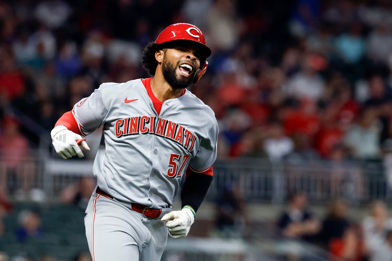 Cincinnati Reds' Rece Hinds reacts after hitting a two-run home run during the ninth inning of a baseball game against the Atlanta Braves, Thursday, May 8, 2025, in Atlanta. (AP Photo/Butch Dill)