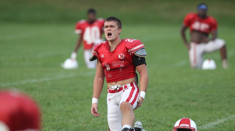Wittenberg’s Keenan Wilson stretches after practice on Wednesday, Sept. 21, 2017, in Springfield. David Jablonski/Staff