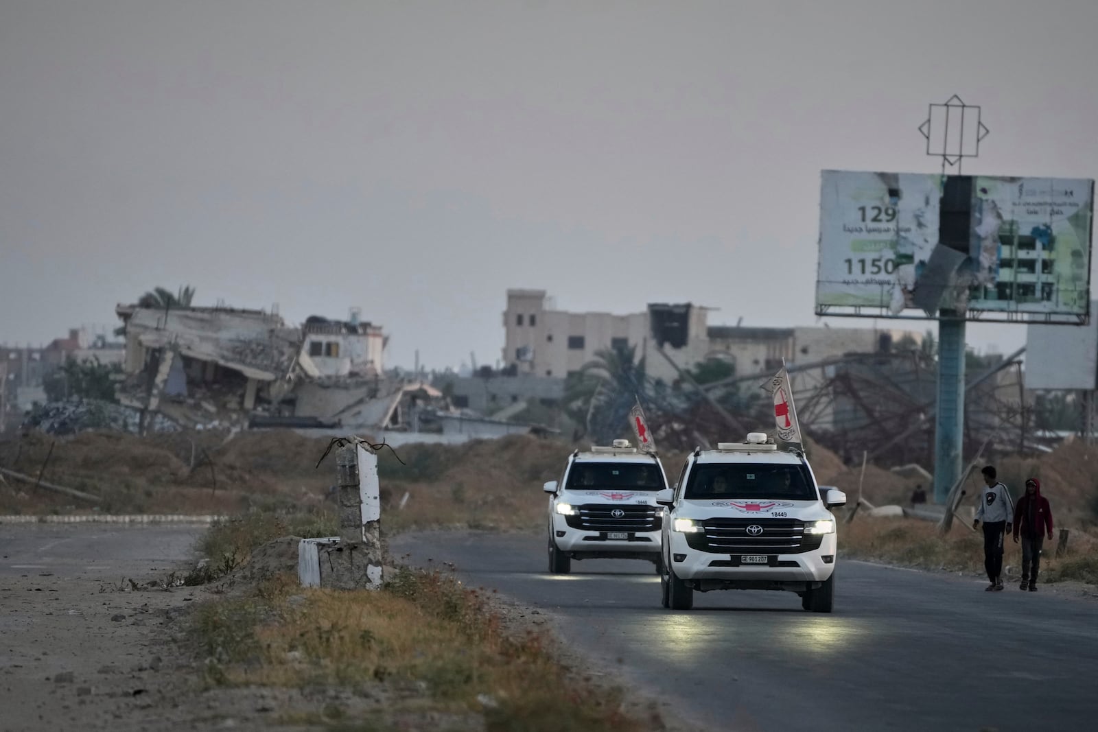 Red Cross vehicles carrying American-Israeli hostage and soldier Edan Alexander leave the Gaza Strip after he was handed over to the organization, Monday, May 12, 2025. (AP Photo/Abdel Kareem Hana)