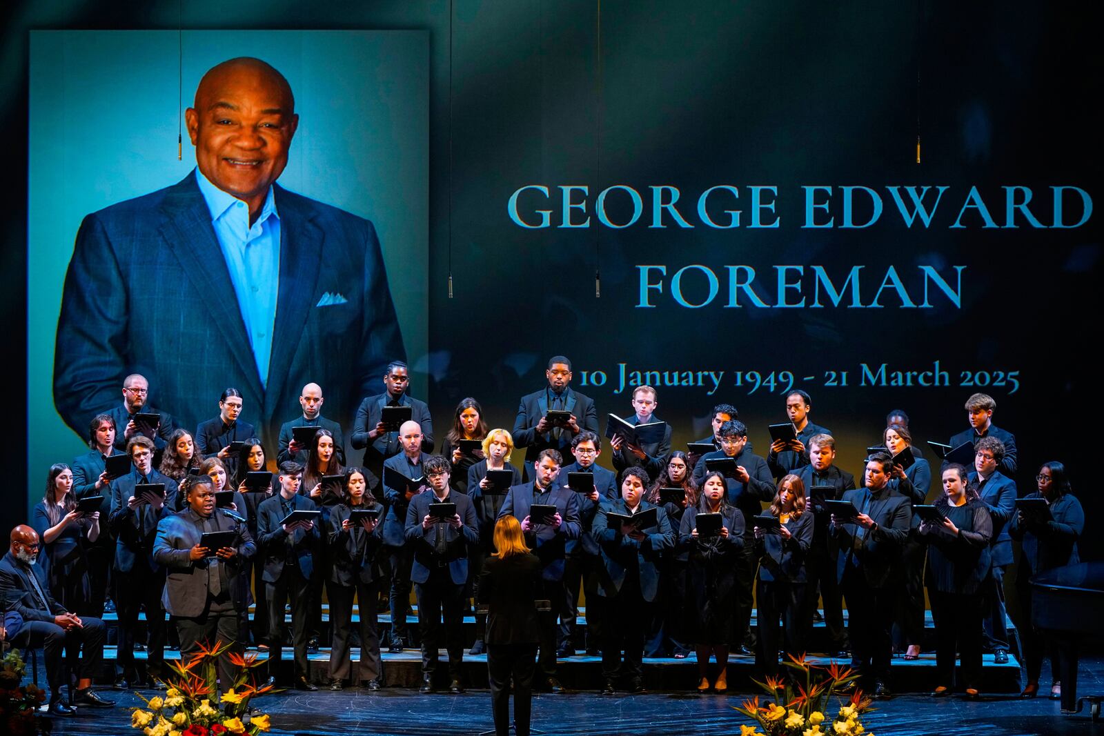 The University of Houston Choir sings "If I Can Help Somebody" during a memorial service for Olympic and world champion boxer and minister George Foreman at Wortham Theater Center in Houston, Monday, April 14, 2025. (Brett Coomer/Houston Chronicle via AP)