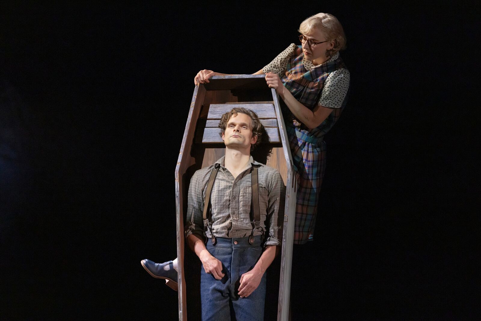 This image released by DKC/O+M shows Andrew Durand, center, with Julia Knitel, during a performance of “Dead Outlaw." (Matthew Murphy/DKC/O+M via AP)