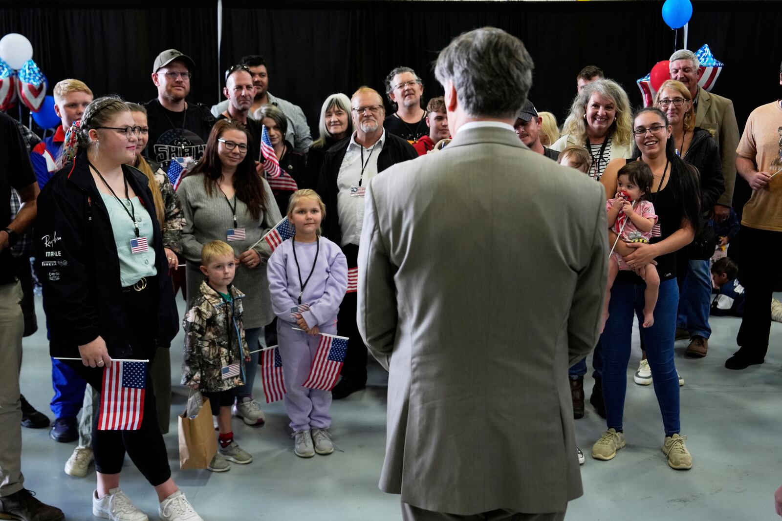 Deputy Secretary of State Christopher Landau greets Afrikaner refugees from South Africa, Monday, May 12, 2025, at Dulles International Airport in Dulles, Va. (AP Photo/Julia Demaree Nikhinson)