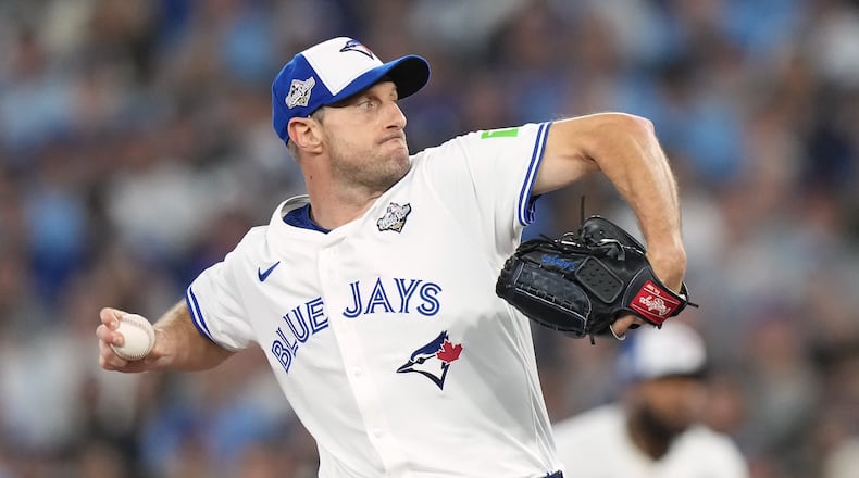FILE - Toronto Blue Jays pitcher Max Scherzer (31) delivers a pitch against the Los Angeles Dodgers during first inning in Game 7 of baseball's World Series in Toronto, Saturday, Nov. 1, 2025. (Nathan Denette/The Canadian Press via AP, File)