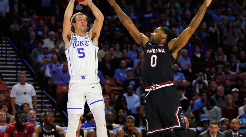 GREENVILLE, SC - MARCH 19: Luke Kennard #5 of the Duke Blue Devils shoots the ball against Sindarius Thornwell #0 of the South Carolina Gamecocks in the first half during the second round of the 2017 NCAA Men’s Basketball Tournament at Bon Secours Wellness Arena on March 19, 2017 in Greenville, South Carolina. (Photo by Kevin C. Cox/Getty Images)