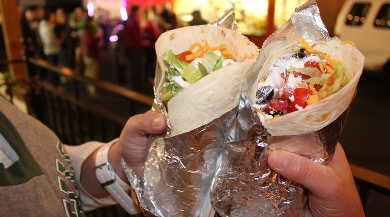 The Dayton Beer Company hosted the Greater Dayton Chapter Ohio University Alumni Association “Athens Invasion in Dayton” on Tuesday, Nov. 10, 2015. The event brought out a sizeable crowd that was craving the famous burritos, tacos, nachos and taco salads of Athens-based Burrito Buggy. (AMELIA ROBINSON/STAFF)