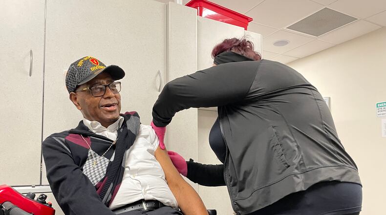 Former Springfield police chief Roger Evans gets his second booster during a vaccine clinic at Rocking Horse in Springfield on Friday.