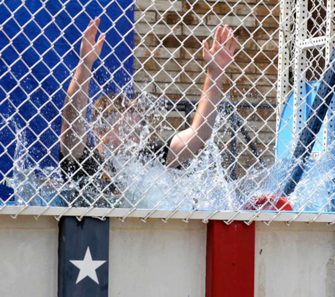 Sun columnist Andy McGinn sits in a dunking tank for charity