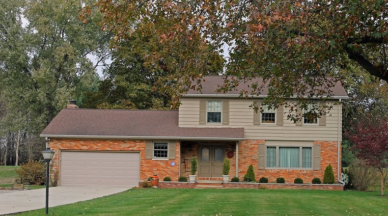 This 2-story home offers about 2,370 sq. ft. of living space with 4 bedrooms and an updated kitchen. The home includes a screened-in porch, attached, 2-car garage and full basement. CONTRIBUTED PHOTO BY VICKIE KAPNAS