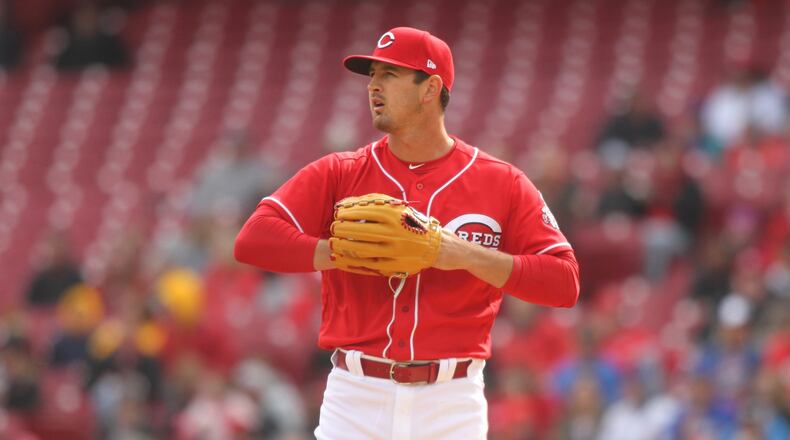 Reds starter Tyler Mahle prepares to pitch against the Cubs on Monday, April 2, 2018, at Great American Ball Park in Cincinnati. David Jablonski/Staff