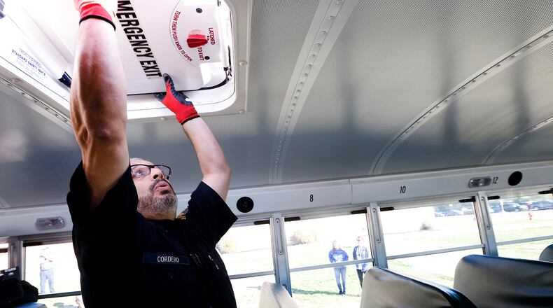 Motor Vehicle Inspector, Elvin Cordero, demonstrates Monday, Oct. 21, 2024 at Springboro High School all the checks that they preform during a safety inspection on a school bus. Since 2019, there have been 6,145 traffic crashes involving school buses in Ohio. During this time, eight crashes involved fatalities, including one student killed on a school bus. MARSHALL GORBY\STAFF