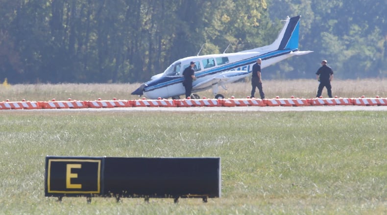 Emergency personnel responded Monday afternoon following a report of a plane that reportedly had landing gear issues at Springfield-Beckley Airport. BILL LACKEY/STAFF