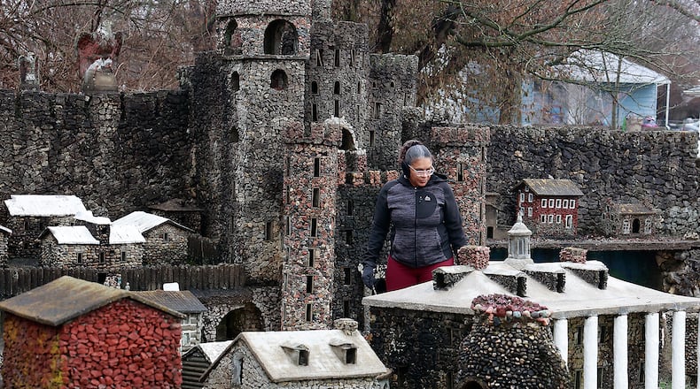 Alma Coleman looks over the stone creations as she walks through the Hartman Rock Garden, in Springfield on Thursday, Jan. 12, 2023. BILL LACKEY/STAFF