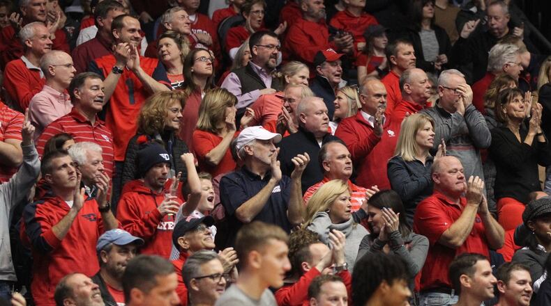 Dayton fans cheer during a game against George Mason on Wednesday, Jan. 23, 2019, at UD Arena. David Jablonski/Staff