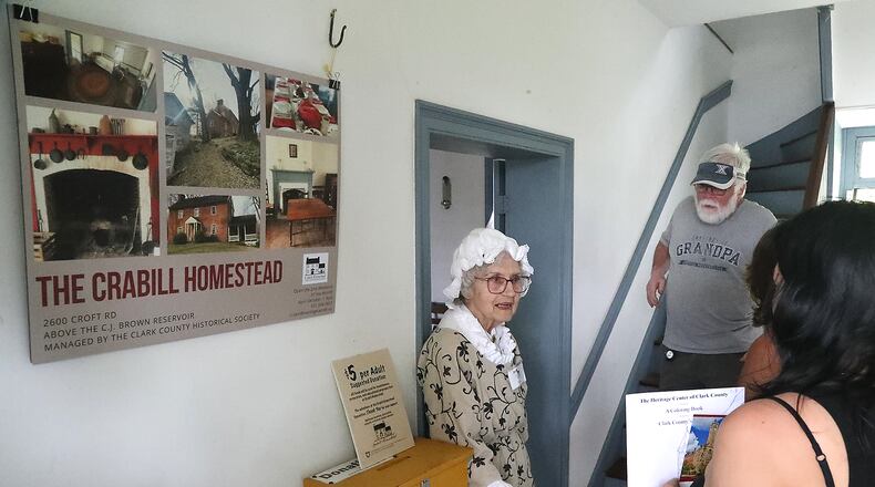 Pat Tipton gives people a tour of the Crabill Homestead Saturday, May 14, 2022 during an open house. BILL LACKEY/STAFF