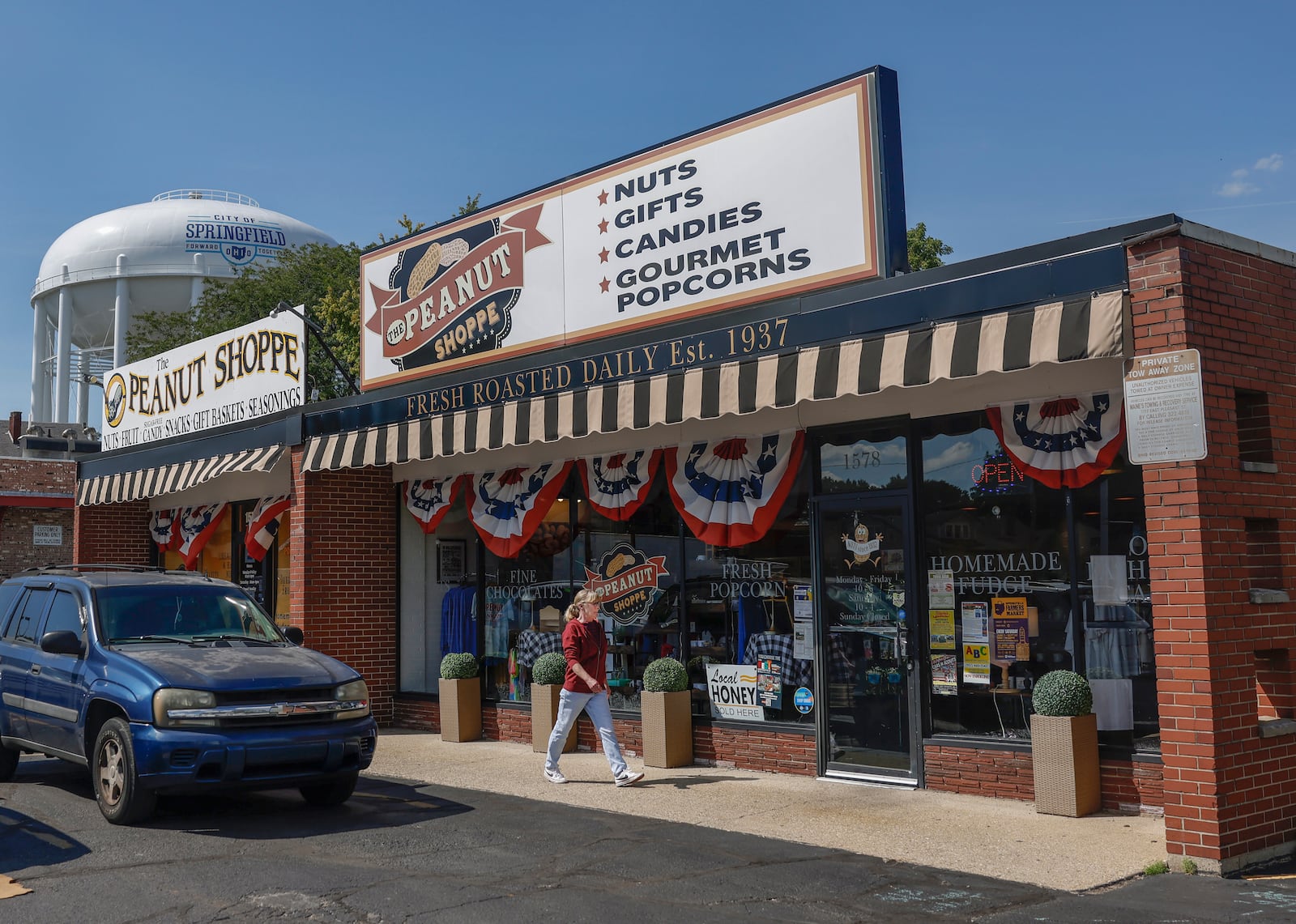 A customer walks toward the Peanut Shoppe on Wednesday, September 3, 2025, in Springfield. JOSEPH COOKE/STAFF