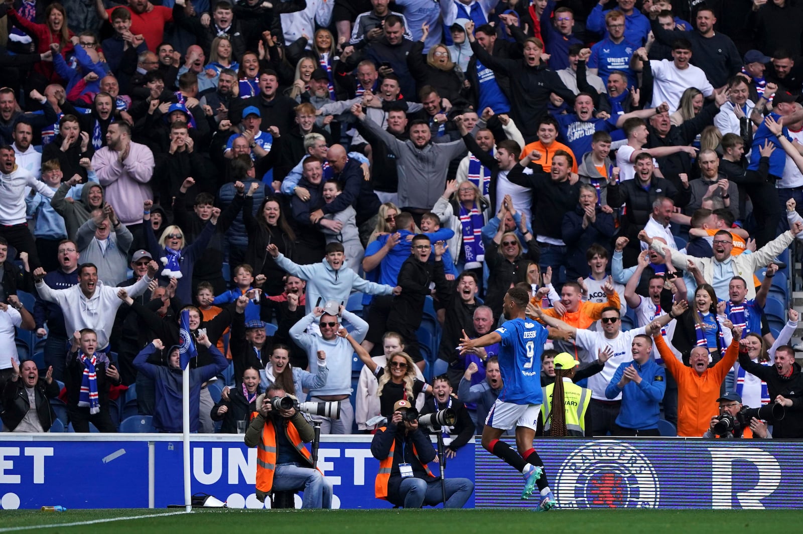 Rangers' Cyriel Dessers celebrates scoring their side's first goal of the game during the Scottish Premiership soccer match between Rangers and Celtic at Ibrox Stadium, Glasgow, Scotland, Sunday, May 4, 2025. (Steve Welsh/PA via AP)