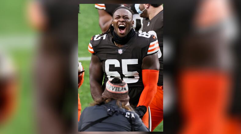 Cleveland Browns defensive tackle Larry Ogunjobi celebrates after the team defeated the Pittsburgh Steelers in an NFL football game, Sunday, Jan. 3, 2021, in Cleveland. (AP Photo/Ron Schwane)