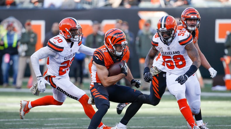 Cincinnati Bengals wide receiver Alex Erickson (12) runs the ball against Cleveland Browns outside linebacker Christian Kirksey (58) in the second half of an NFL football game, Sunday, Nov. 26, 2017, in Cincinnati. (AP Photo/Frank Victores)
