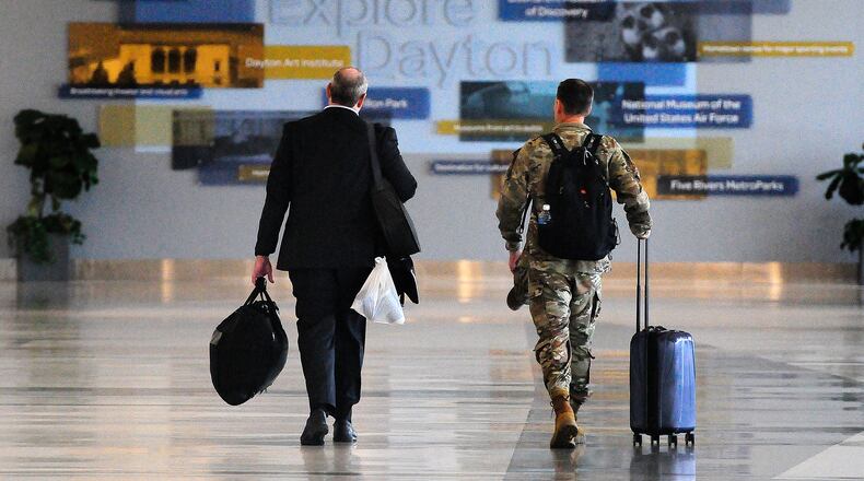 Travelers walk through Dayton International Airport Thursday, June 27, 2024. MARSHALL GORBY/STAFF