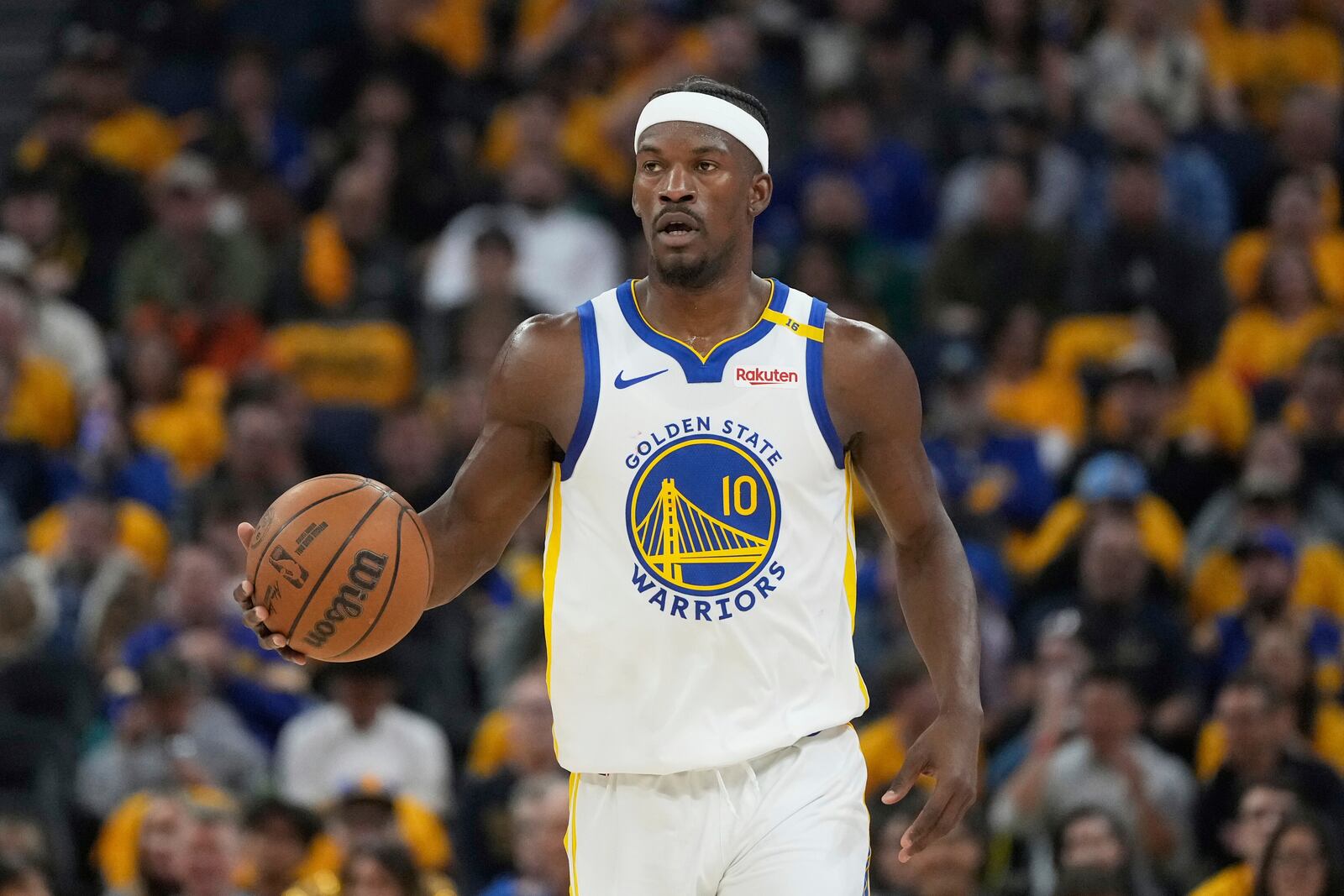 Golden State Warriors forward Jimmy Butler III brings the ball up the court against the Memphis Grizzlies during the first half of an NBA play-in tournament basketball game in San Francisco, Tuesday, April 15, 2025. (AP Photo/Jeff Chiu)