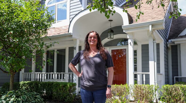 Kathyn Tolbert poses in front of her home in western Troy on Wednesday, Sept. 3. She recently purchased the property and moved from Butler Township. Ohio’s real estate market emerged as one of the most dynamic in the country during the first half of 2025. The state recorded the second most substantial property value changes nationwide with home prices rising by 18% from January to June. BRYANT BILLING / STAFF