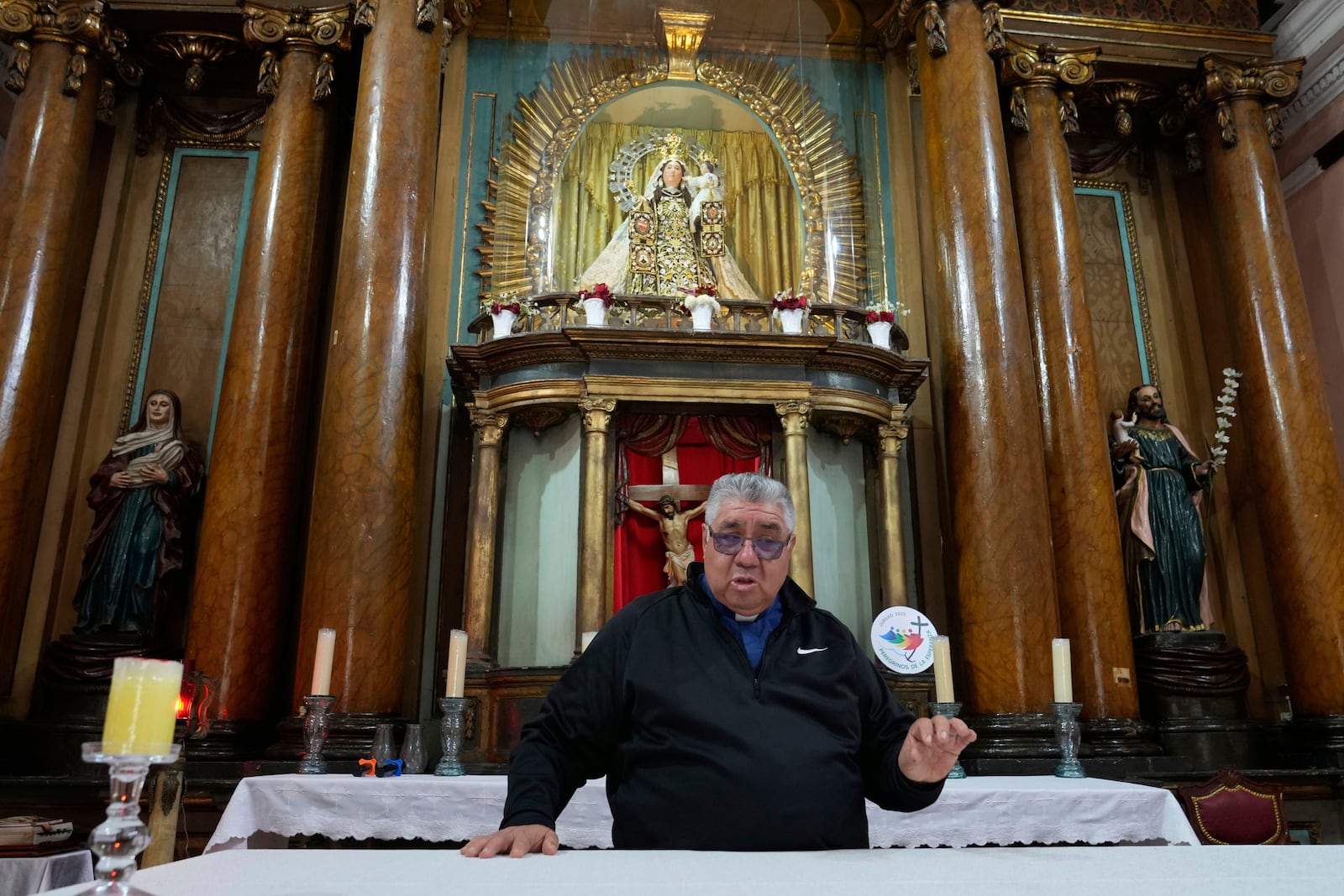 Father Jose Rosario speaks from the altar where Pope Leo XIV celebrated Mass when he was the Apostolic administrator in 2020 in the Diocese of Callao, Peru, Friday, May 9, 2025. (AP Photo/Martin Mejia)