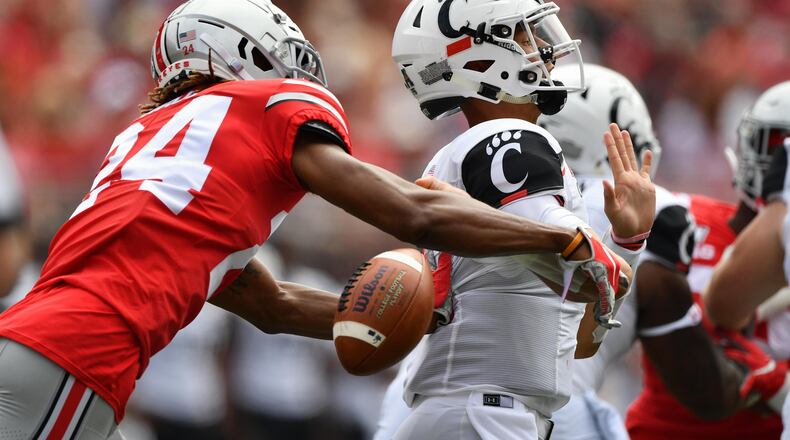 COLUMBUS, OH - SEPTEMBER 7: Quarterback Desmond Ridder #9 of the Cincinnati Bearcats is stripped of the ball by Shaun Wade #24 of the Ohio State Buckeyes as he attempts to pass in the second quarter at Ohio Stadium on September 7, 2019 in Columbus, Ohio. (Photo by Jamie Sabau/Getty Images)
