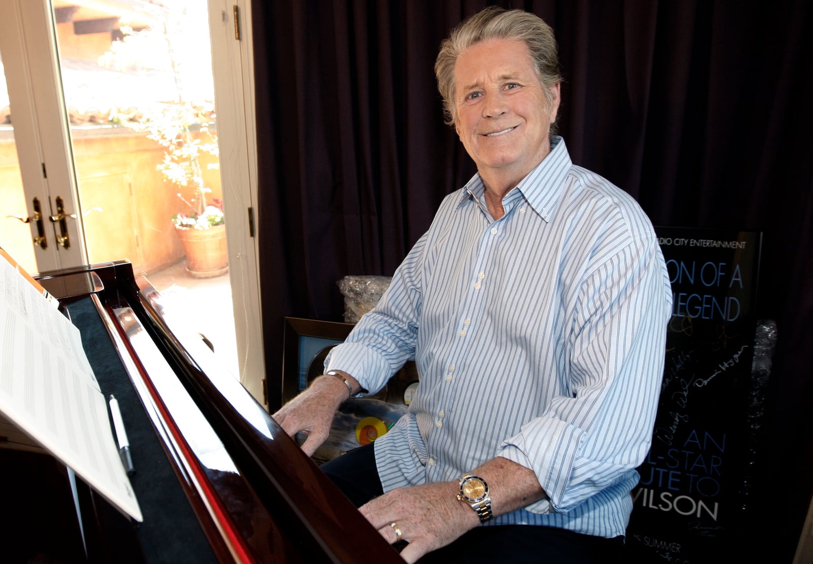 FILE - Musician Brian Wilson poses for a portrait at his home in Los Angeles on July 28, 2008. (AP Photo/Matt Sayles, File)