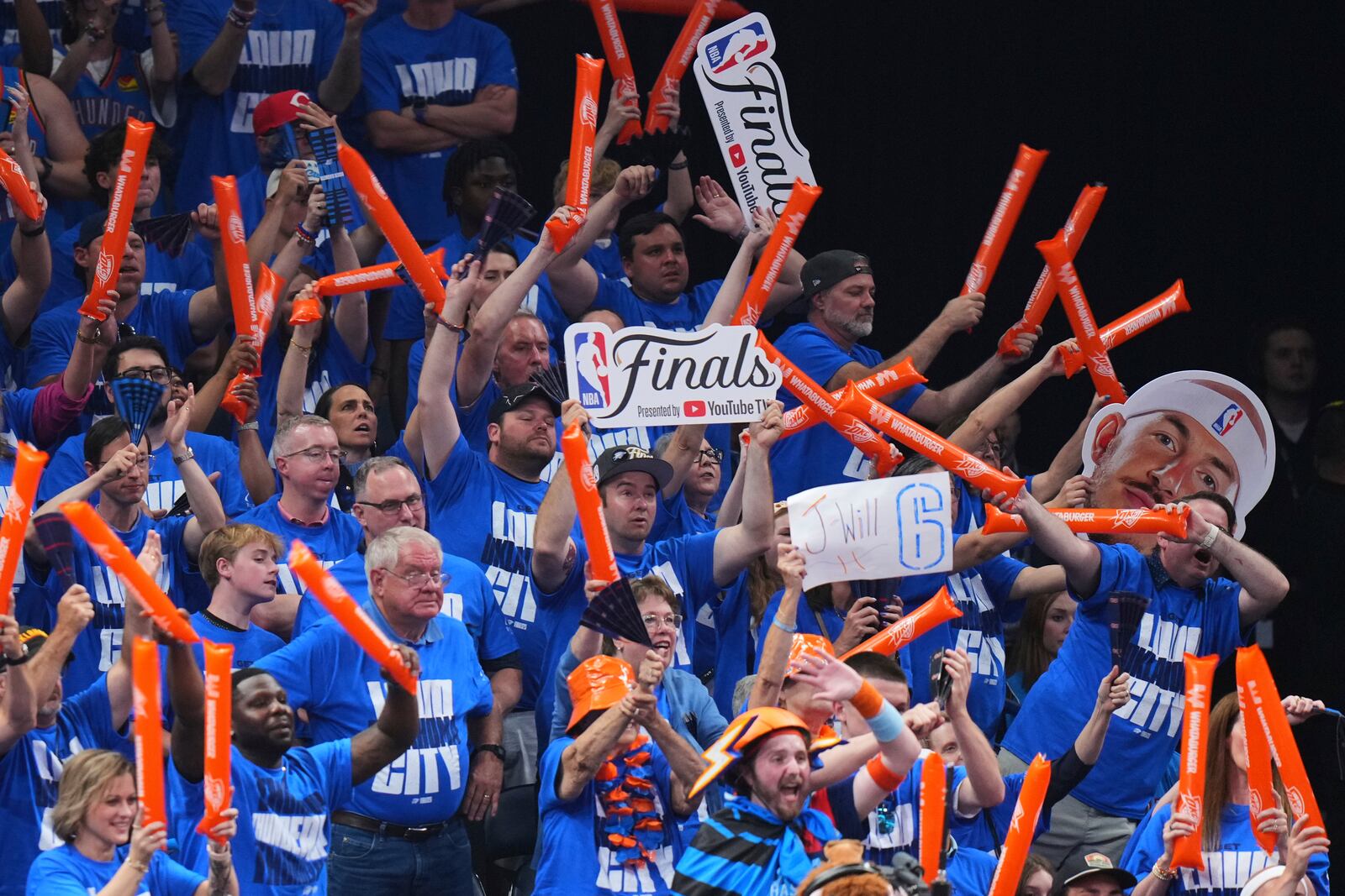 Oklahoma City Thunder fans cheer during the second half of Game 2 of the NBA Finals basketball series against the Indiana Pacers Sunday, June 8, 2025, in Oklahoma City. (AP Photo/Kyle Phillips)
